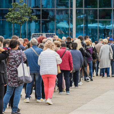 people waiting in line - metaphor for PlanHero waitlist feature for signups