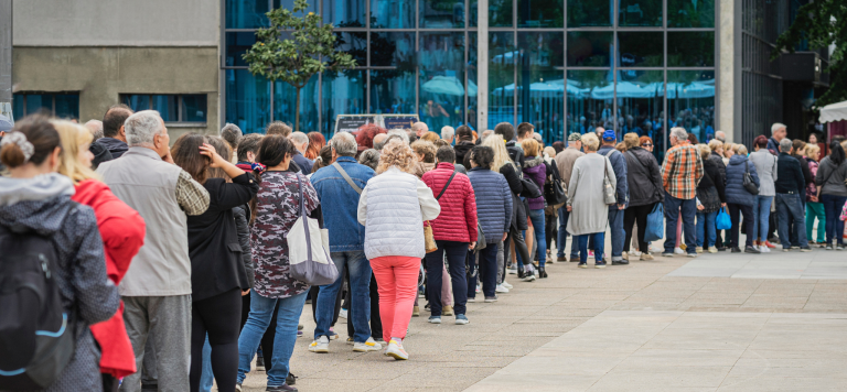 people waiting in line - metaphor for PlanHero waitlist feature for signups